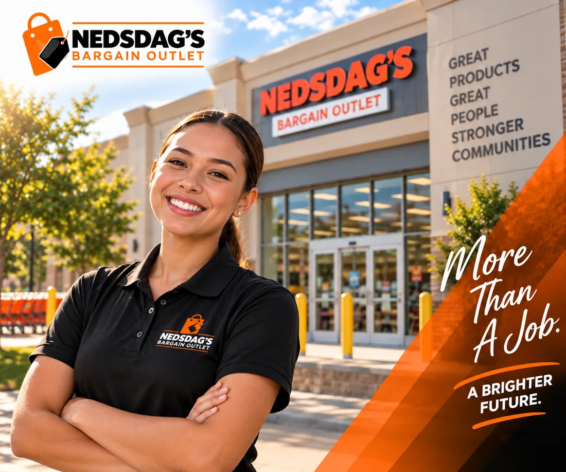 Smiling Nedsdag’s intern with arms crossed outside the Nedsdag’s Bargain Outlet store